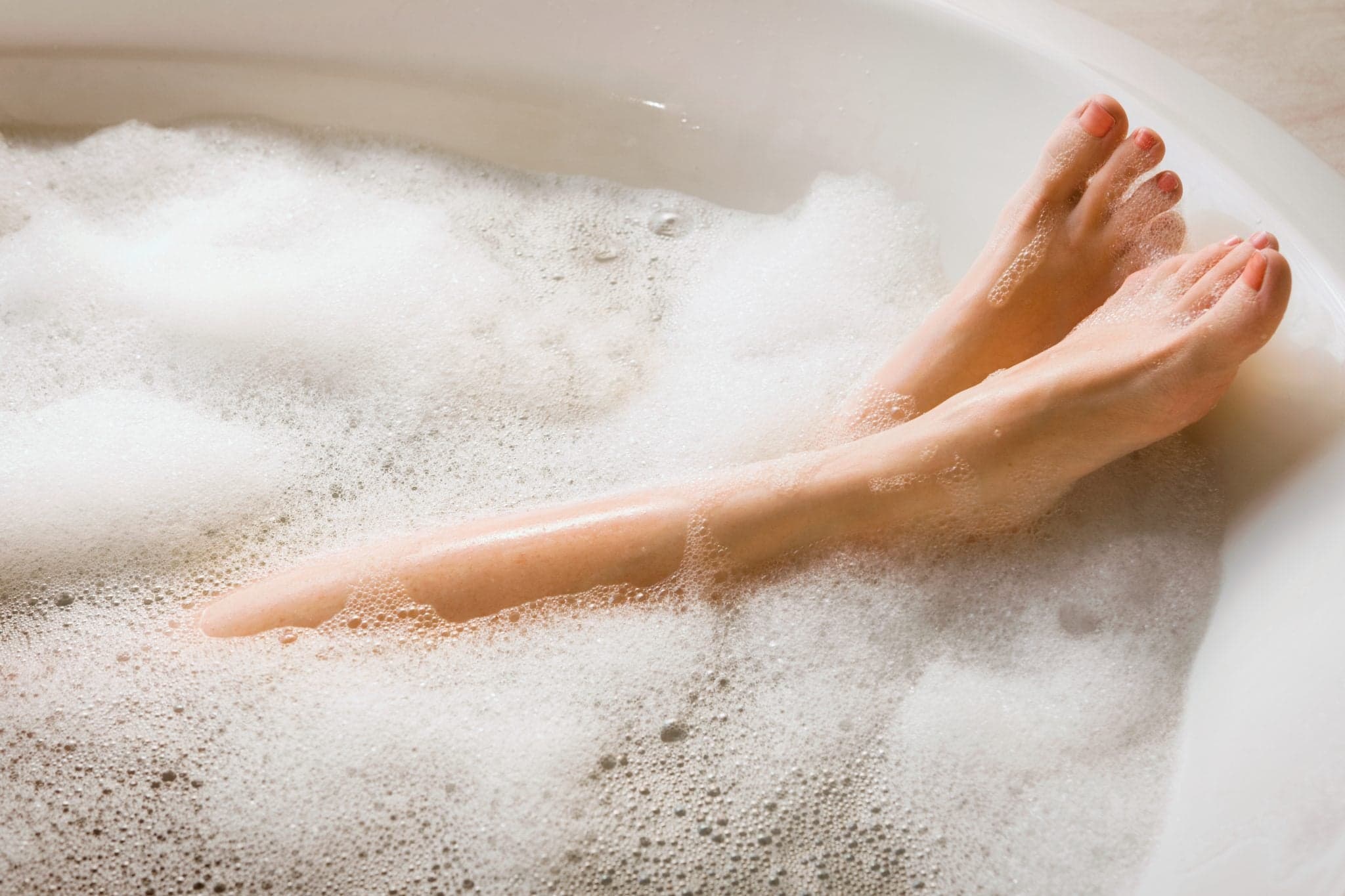 Picture of Woman's Legs in bath; Feet in Bubble Bath