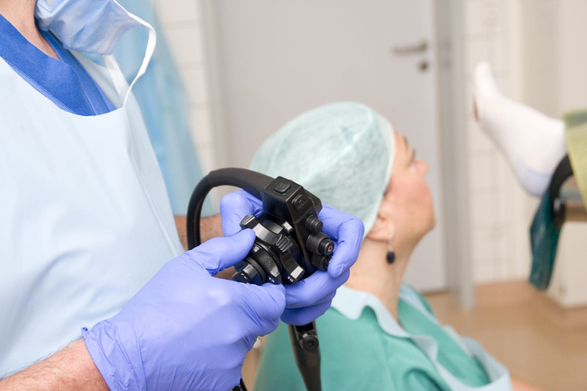 Image of "Close-up of the controls of a colonoscope. This instrument is used for performing colonoscopies, or polyp removal. Progress monitored by surgeon and assistant on computer screen, the patient is under general anesthesia. Selective focus, shallow depth of field."