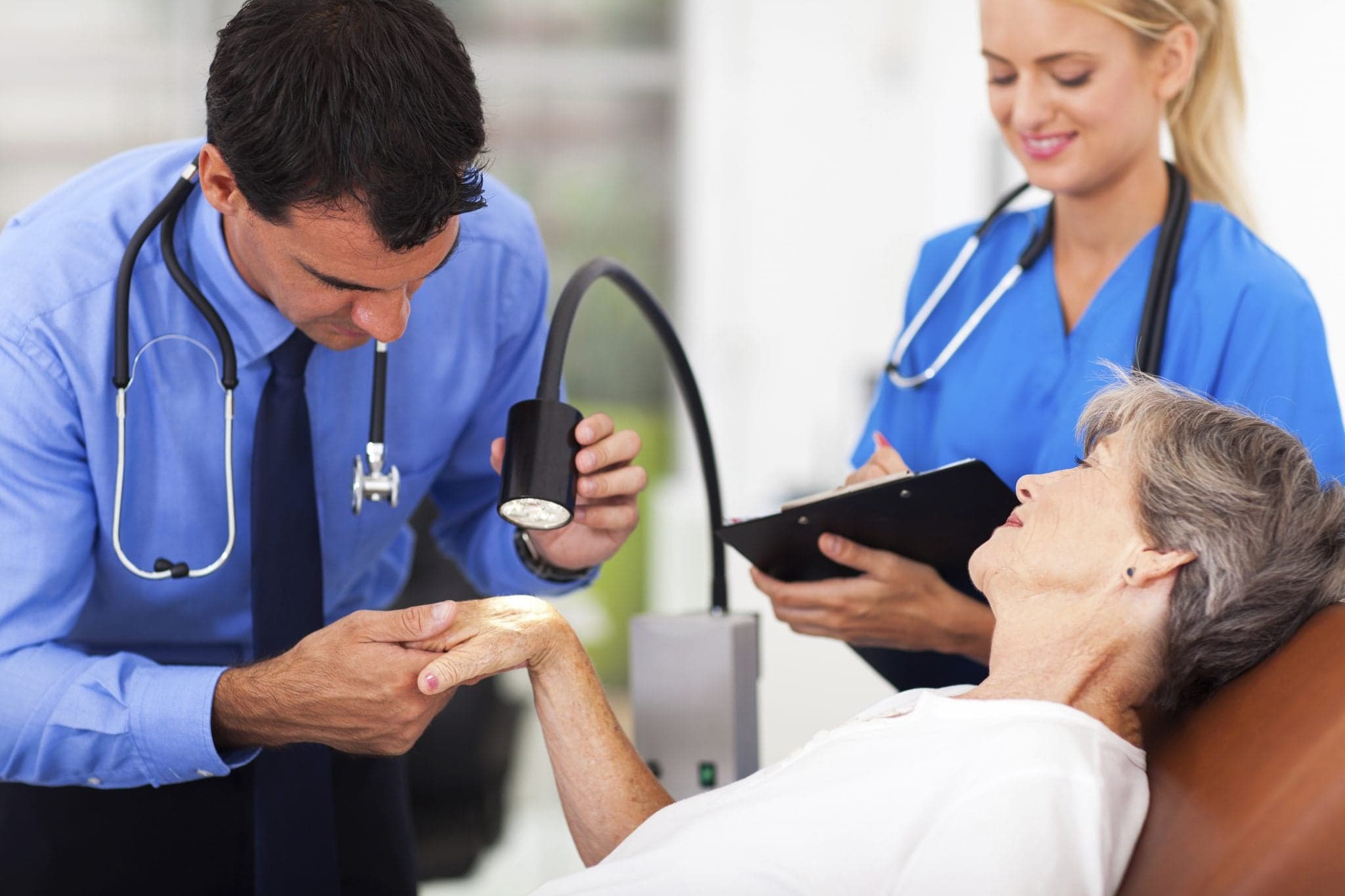 Picture of A senior woman being examined by a dermatologist