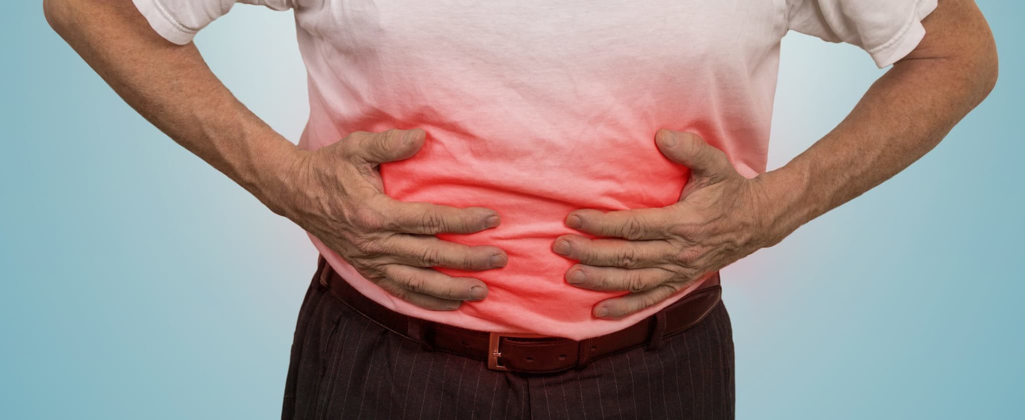 Stomach ache, man placing hands on the abdomen