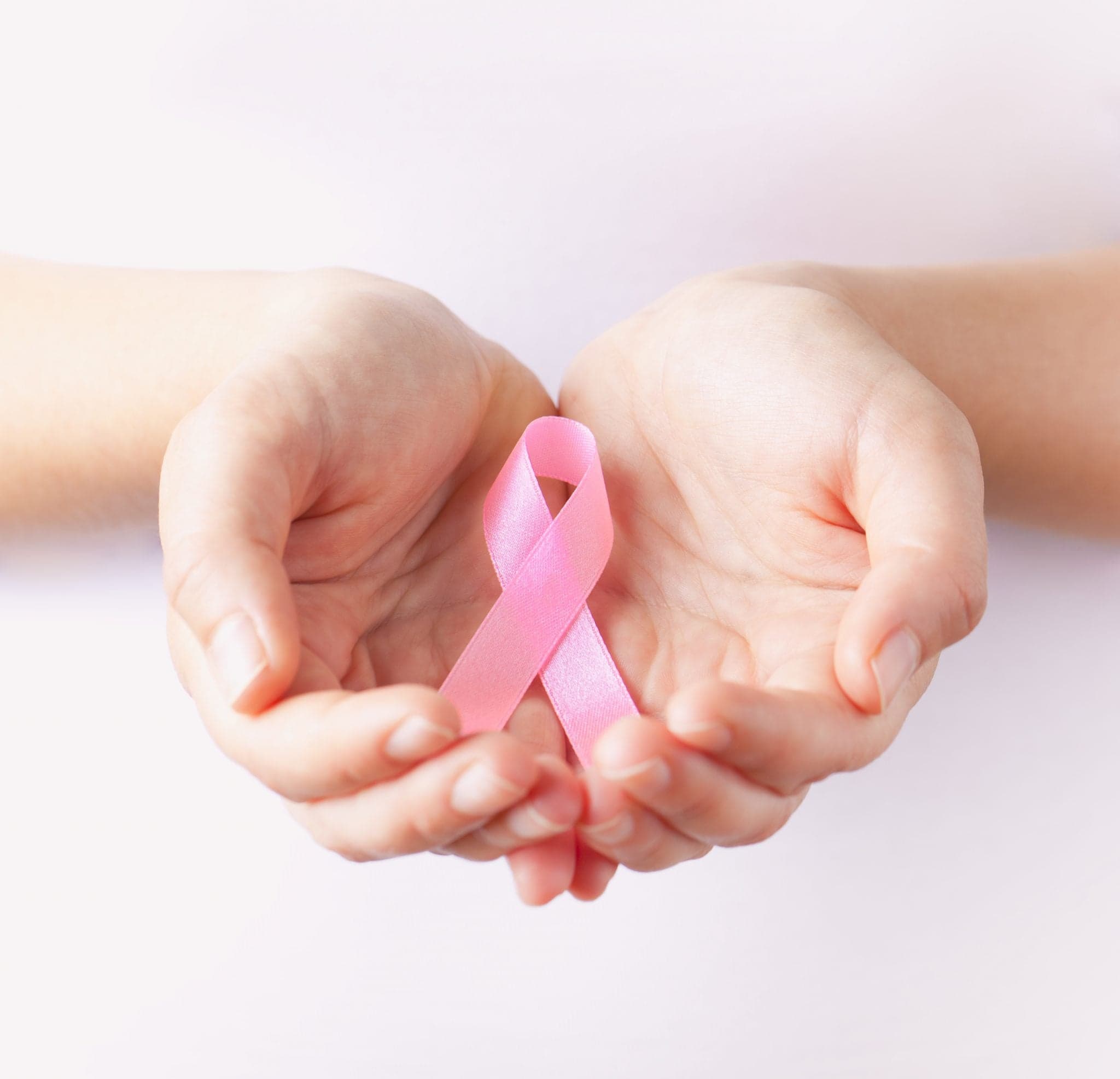 Image of holding pink breast cancer awareness ribbon