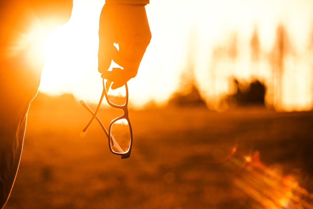 Picture of person holding Glasses at Sunset