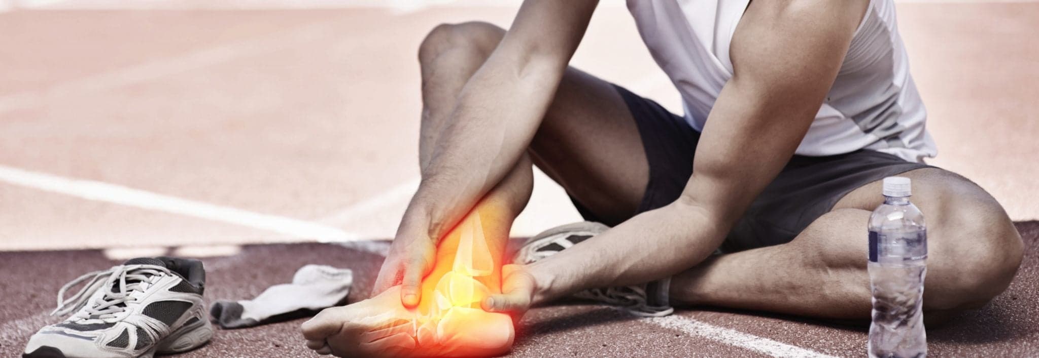 Picture of Shot of a young athlete holding his leg in pain