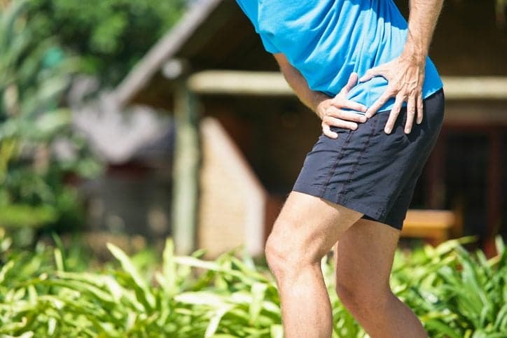 A male person, having severe hip pain, maybe due to an osteoarthritis. Please note the typical flexion of hip during pain attack.