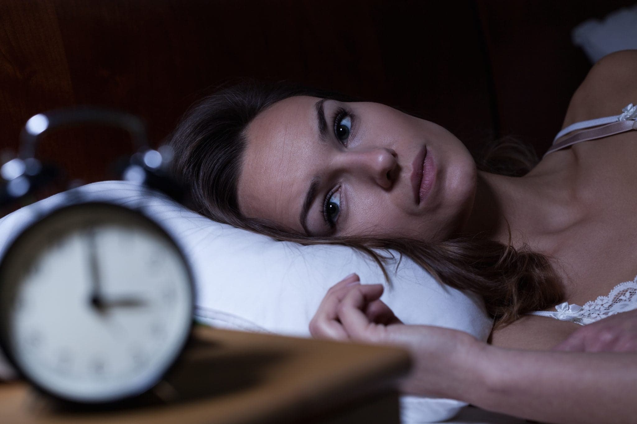 Picture of Woman lying in bed suffering from insomnia