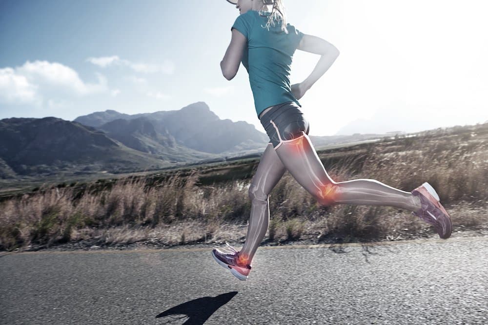 Cropped shot of a young woman out on a country road for a jog