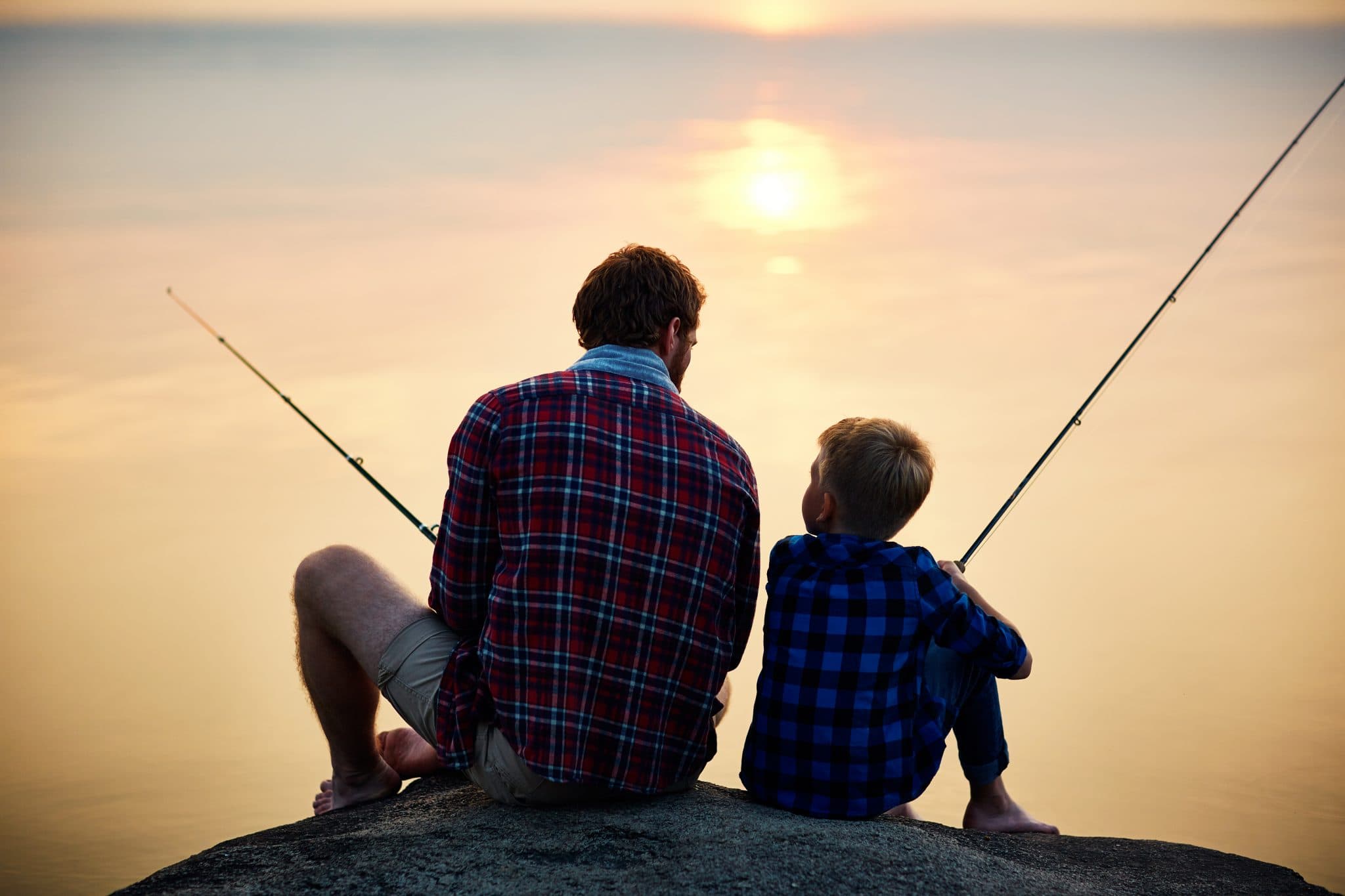 Picture of Father and son fishing at sunset