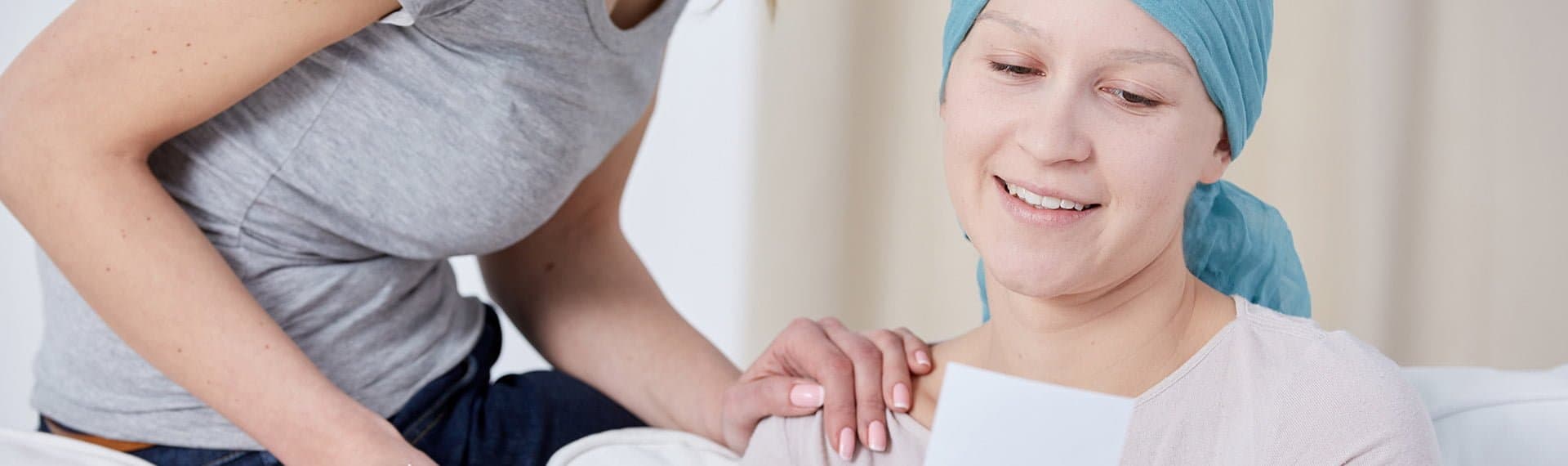 woman talking with female cancer patient