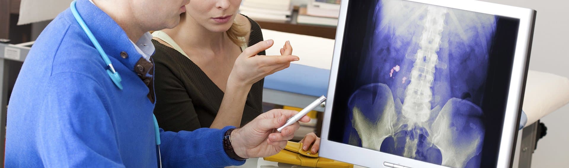 doctor and patient looking at x-ray