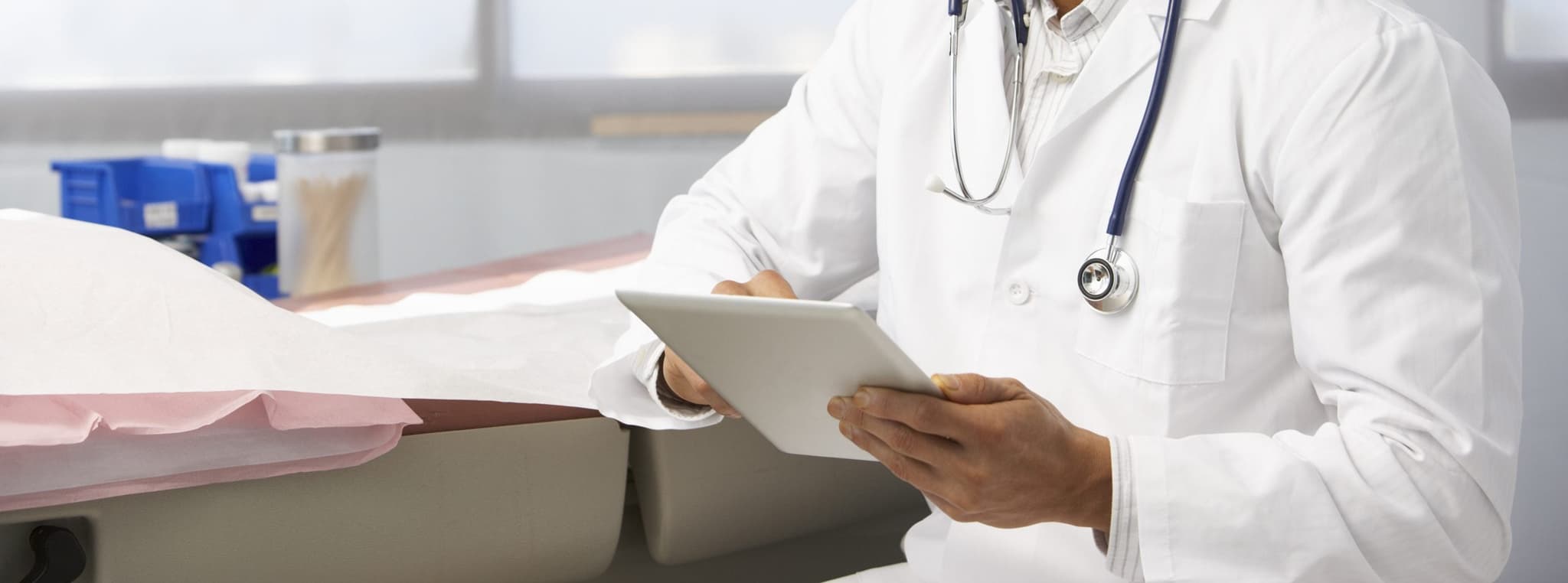 Picture of doctor looking at ipad