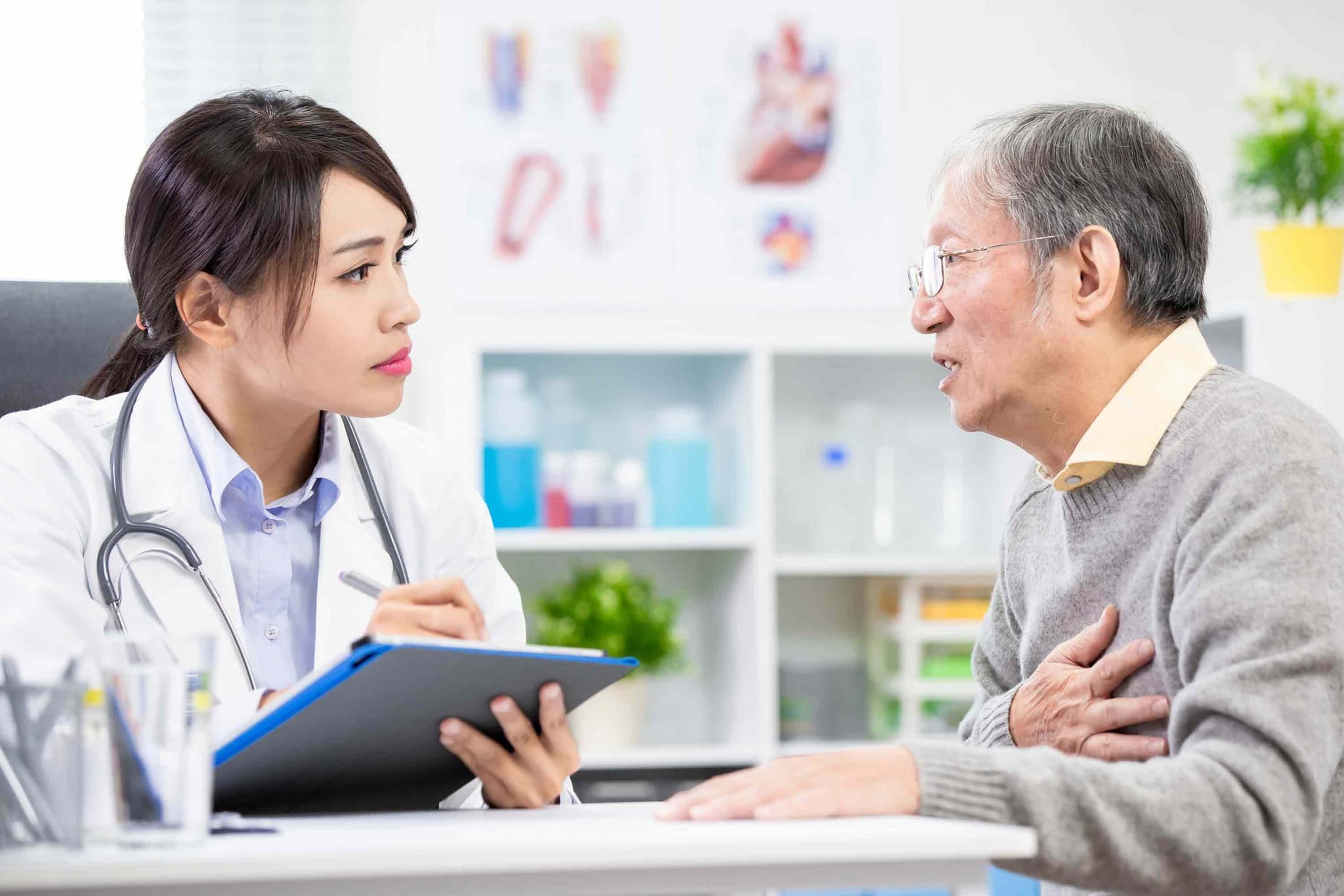 doctor listening to patient explain symptoms