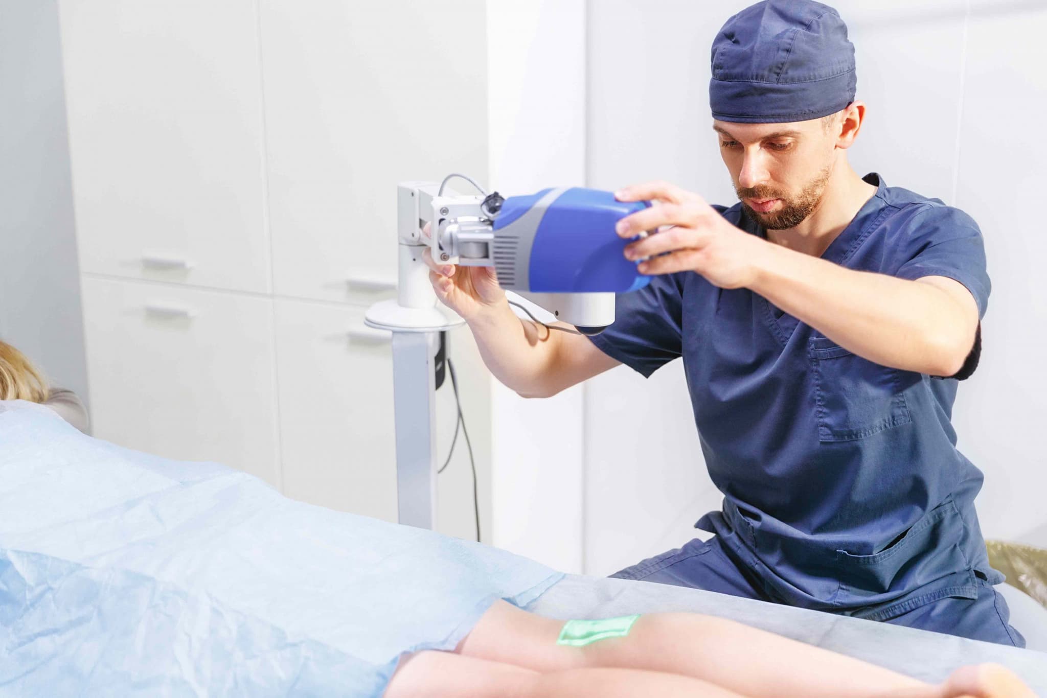 Doctor providing Vein Vascular Treatment