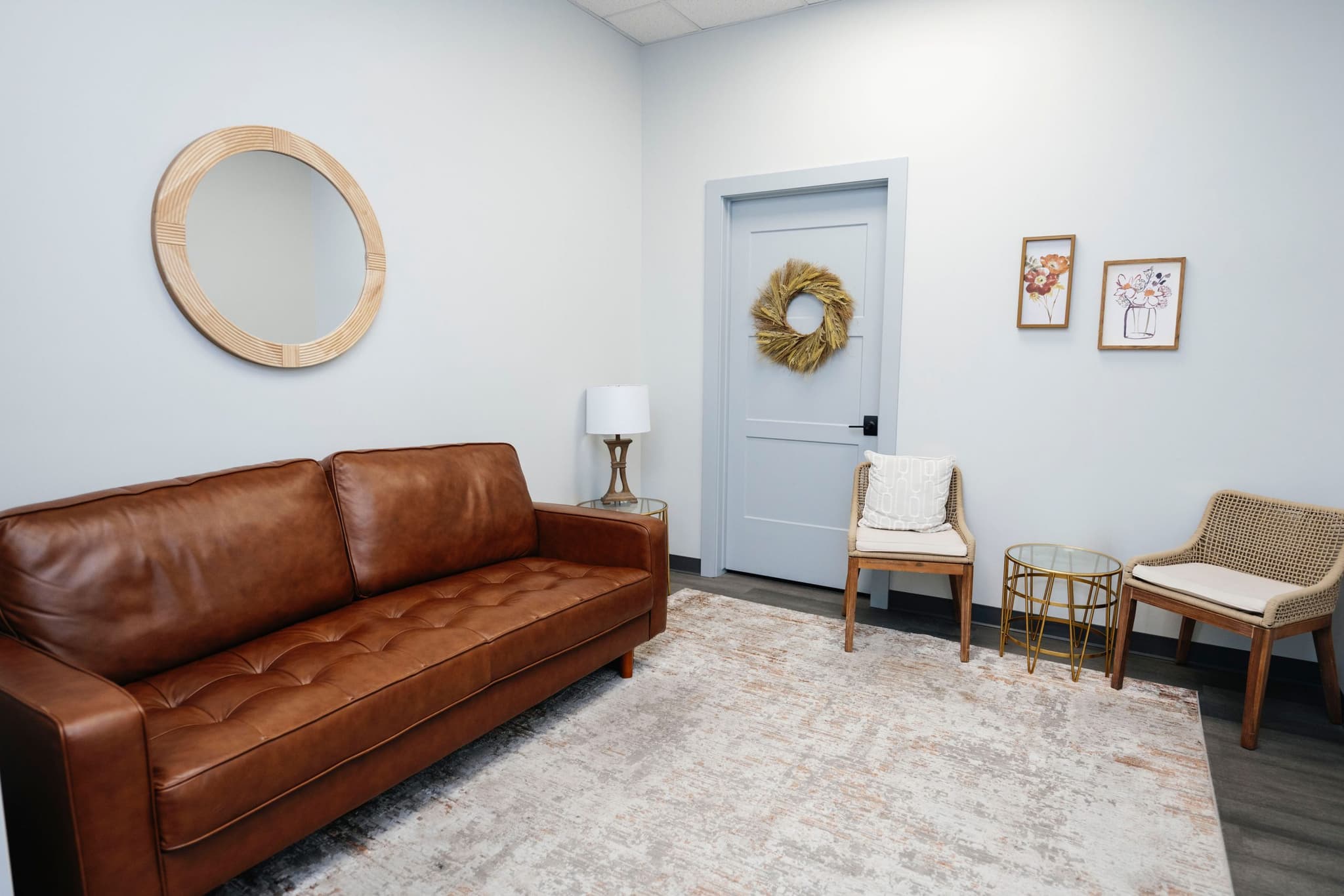 Image of Comfortable room featuring a leather couch and calming decor for a welcoming, patient-focused environment.