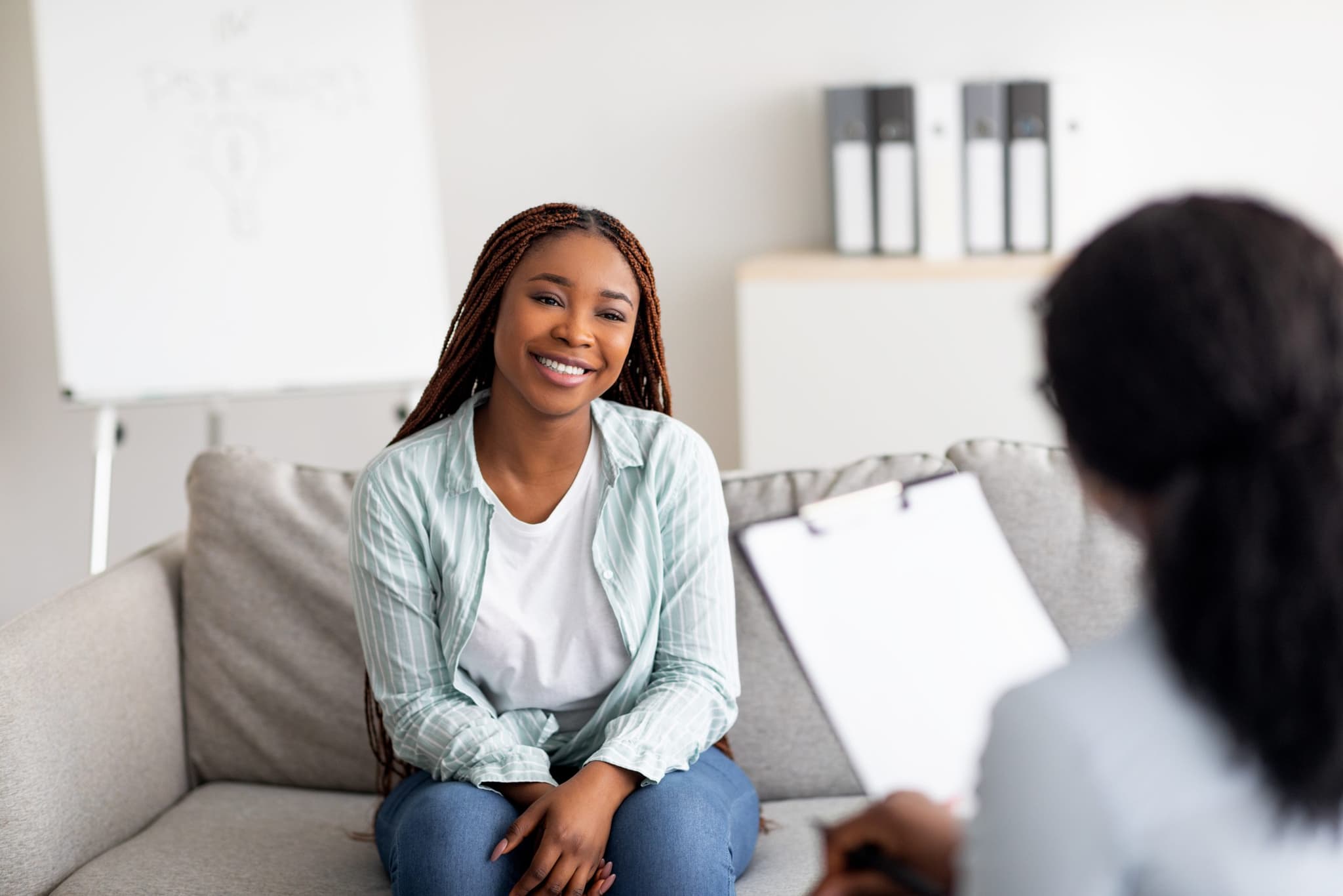 Picture of Young female client having consultation with psychologist, grateful for professional help at clinic. Allan Pauole, a mental health therapist at Revere Health talks about the 7 behavioral health trends to keep in mind.