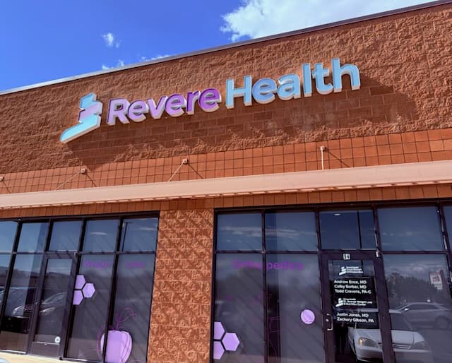 Exterior view of Revere Health St. George Weight Loss and Nutrition Center with large glass windows and recognizable branding.