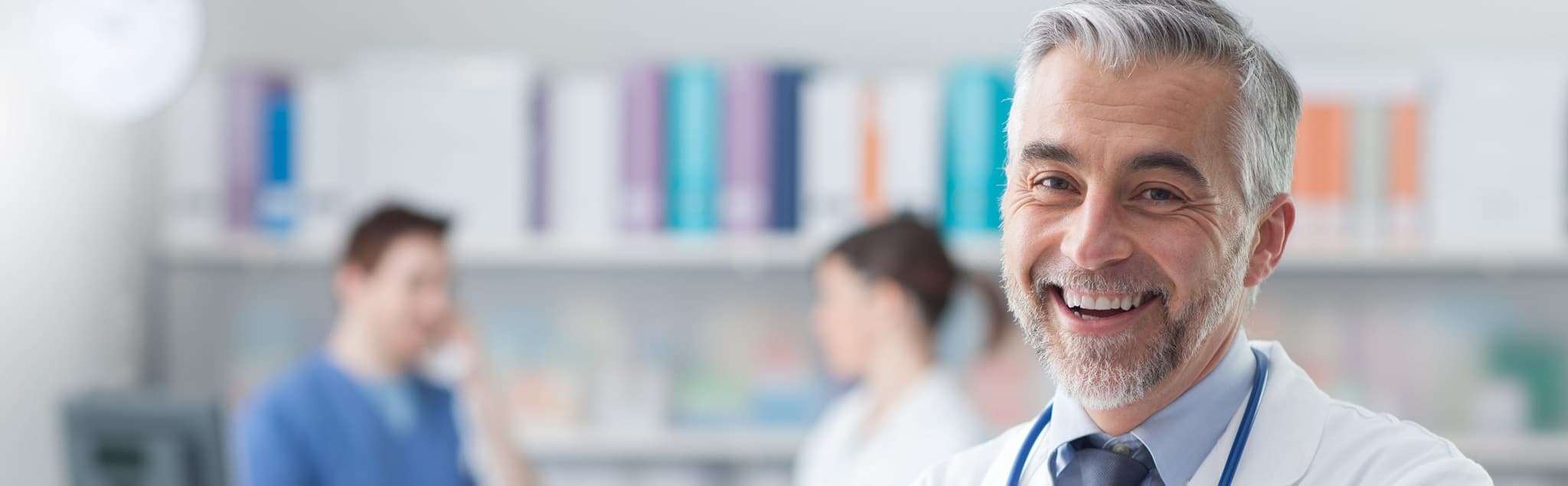 smiling doctor with blurred doctor