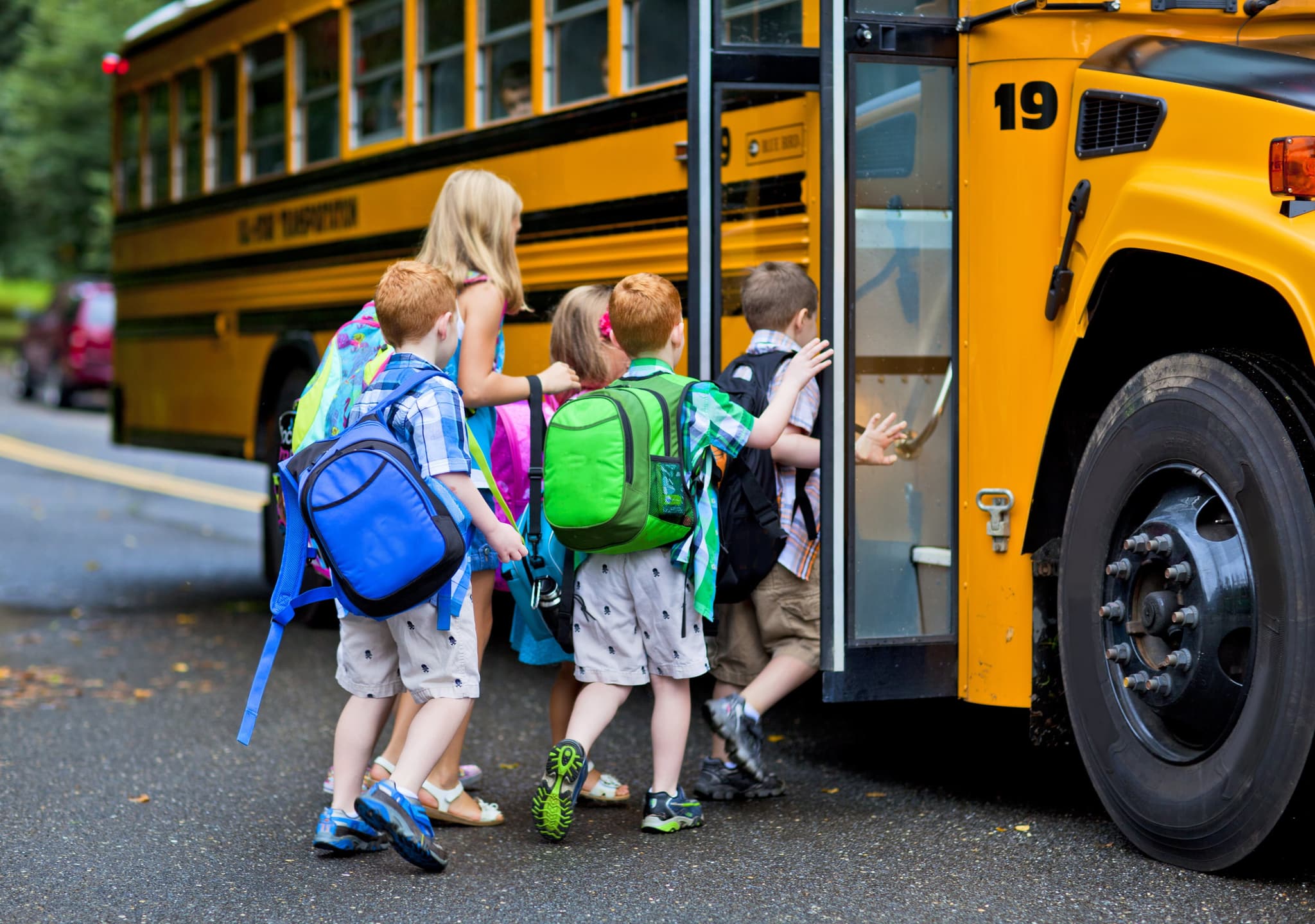 Picture of kids getting on a school bus