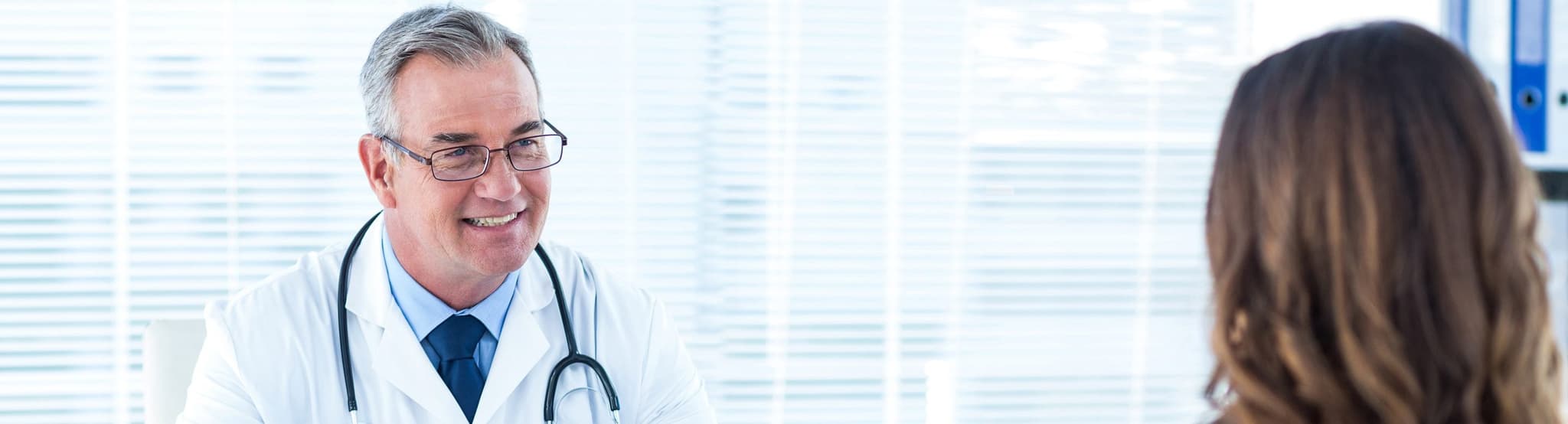 Picture of doctor talking to pregnant woman