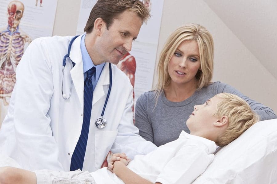 Family Doctor visiting sick child