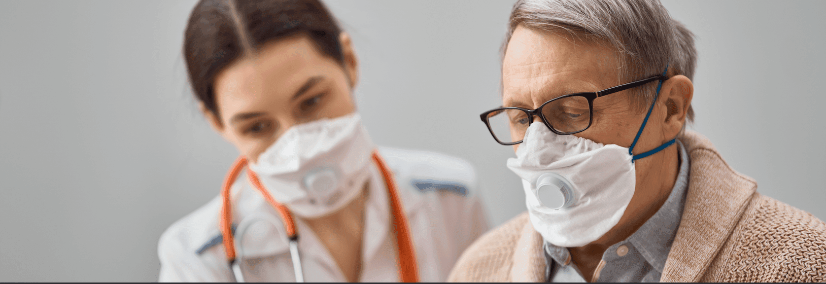 Doctor and patient wearing masks