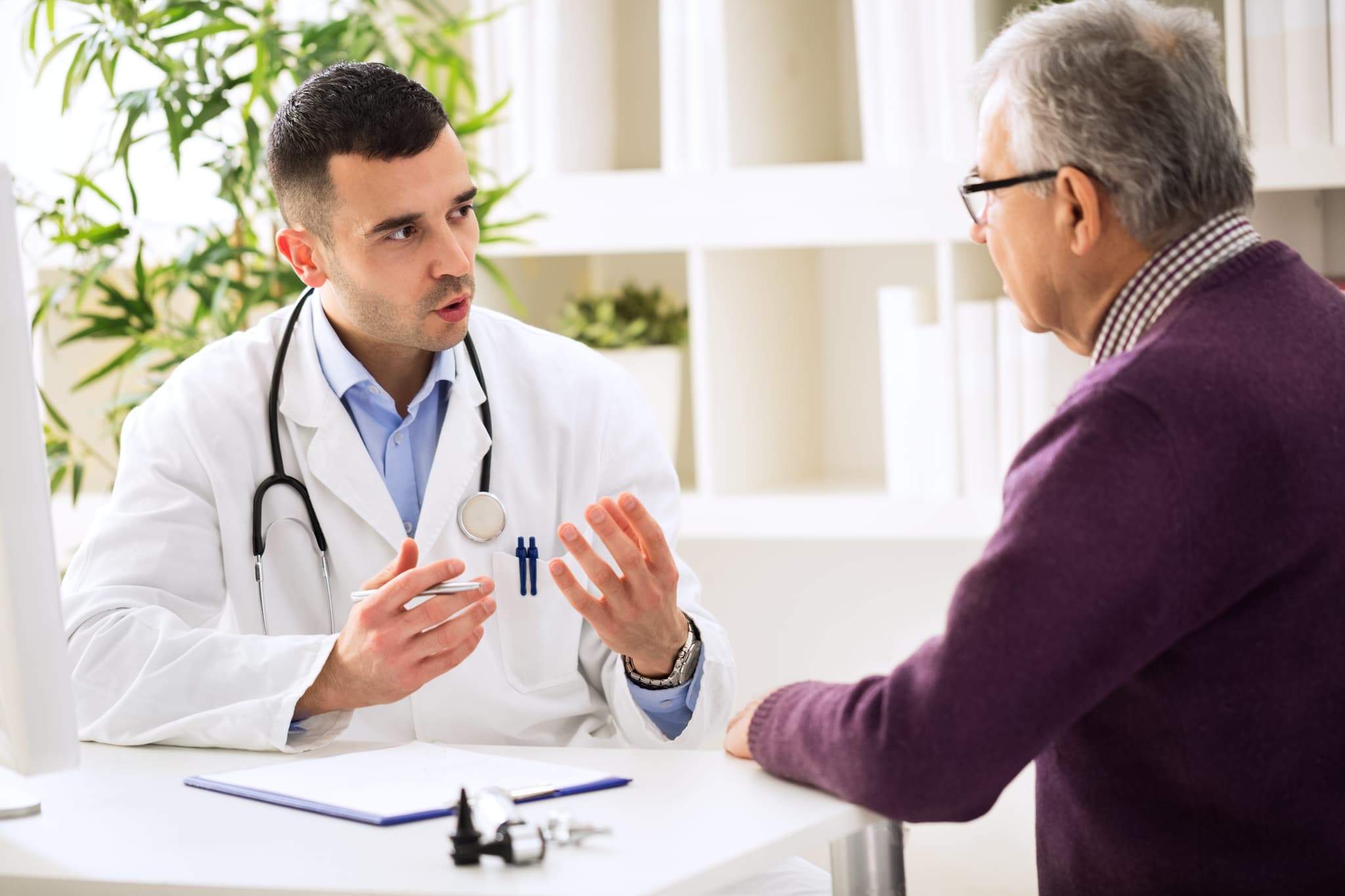 Picture of doctor speaking with elderly man