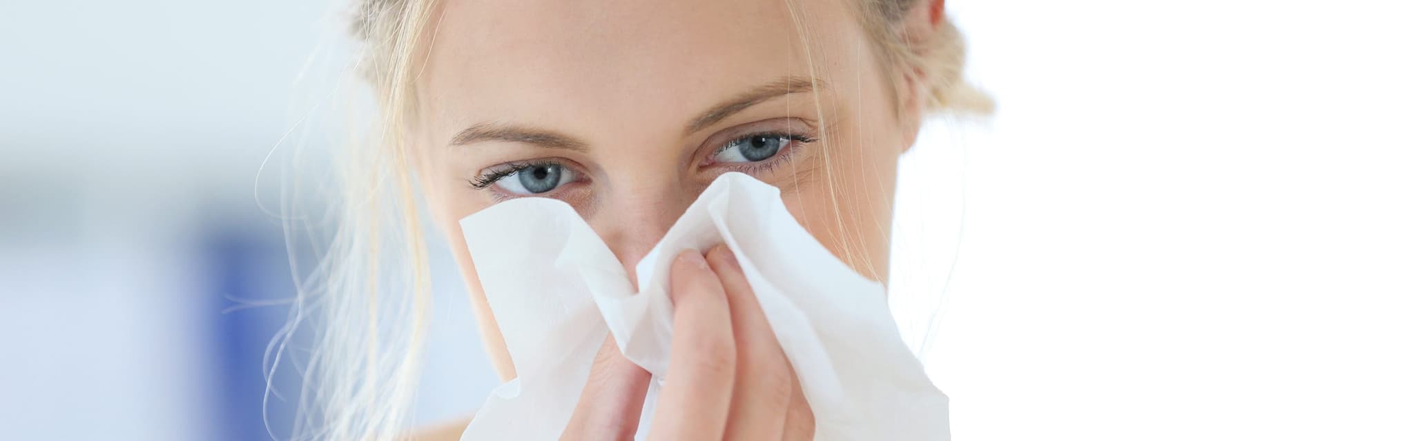 Picture of woman blowing nose