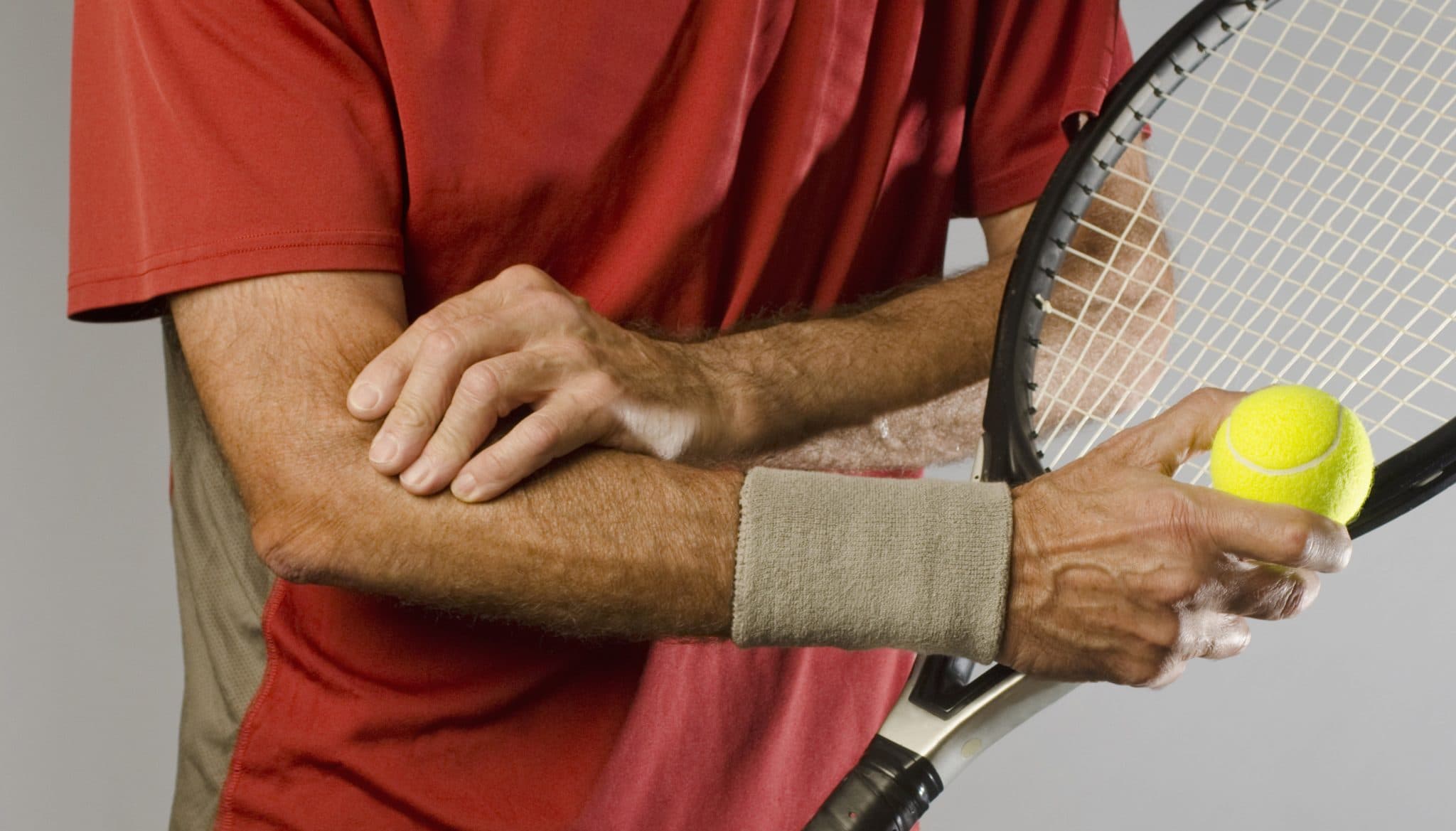 Picture of male tennis player with tennis elbow