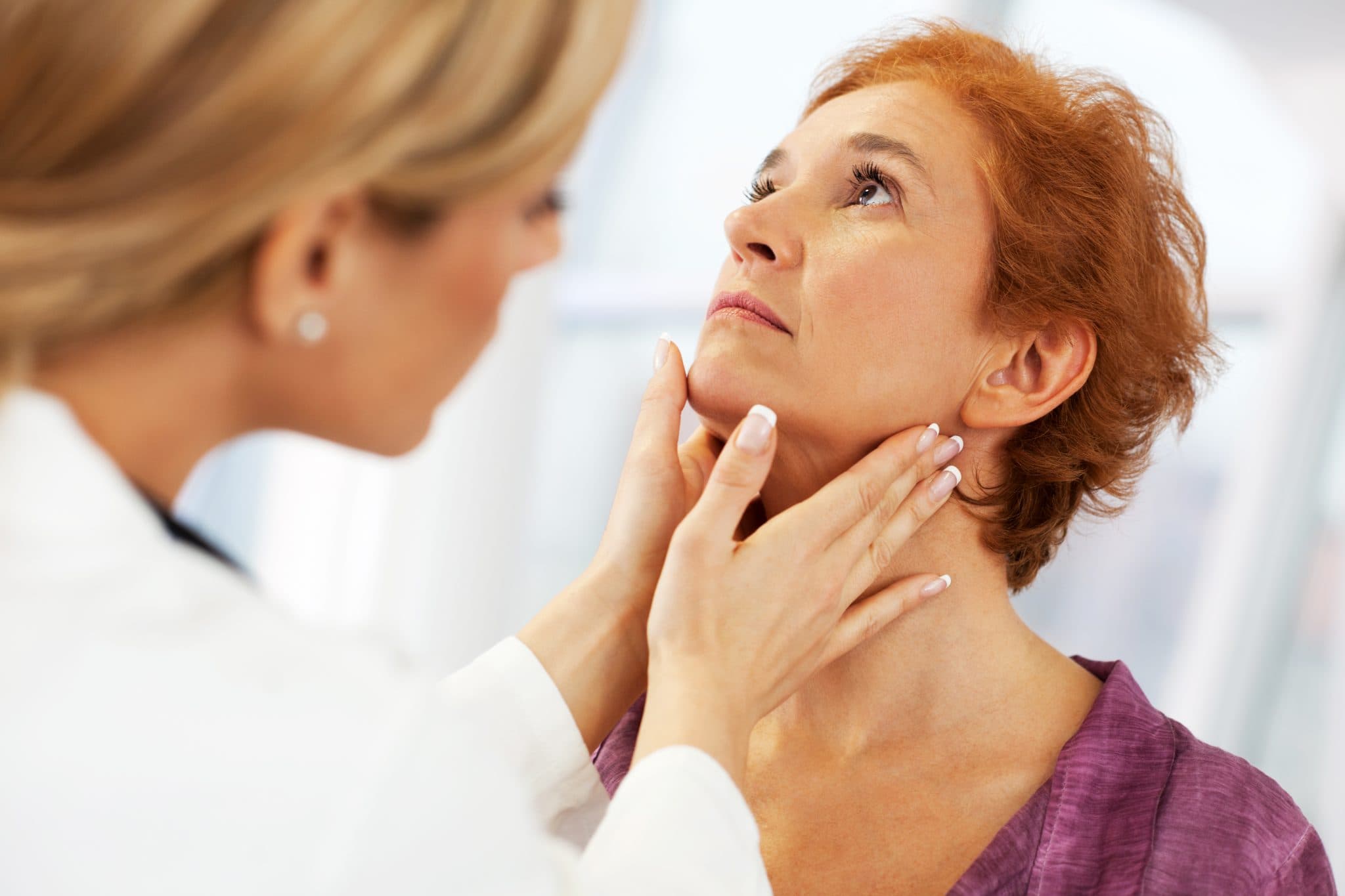 Picture of Female doctor examining her patient's throat