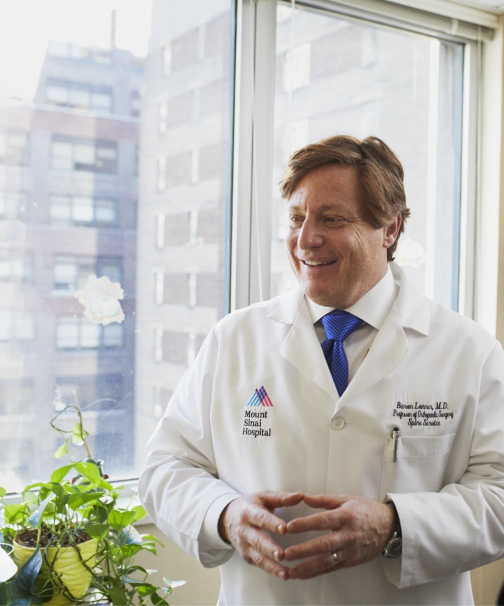 doctor standing next to window