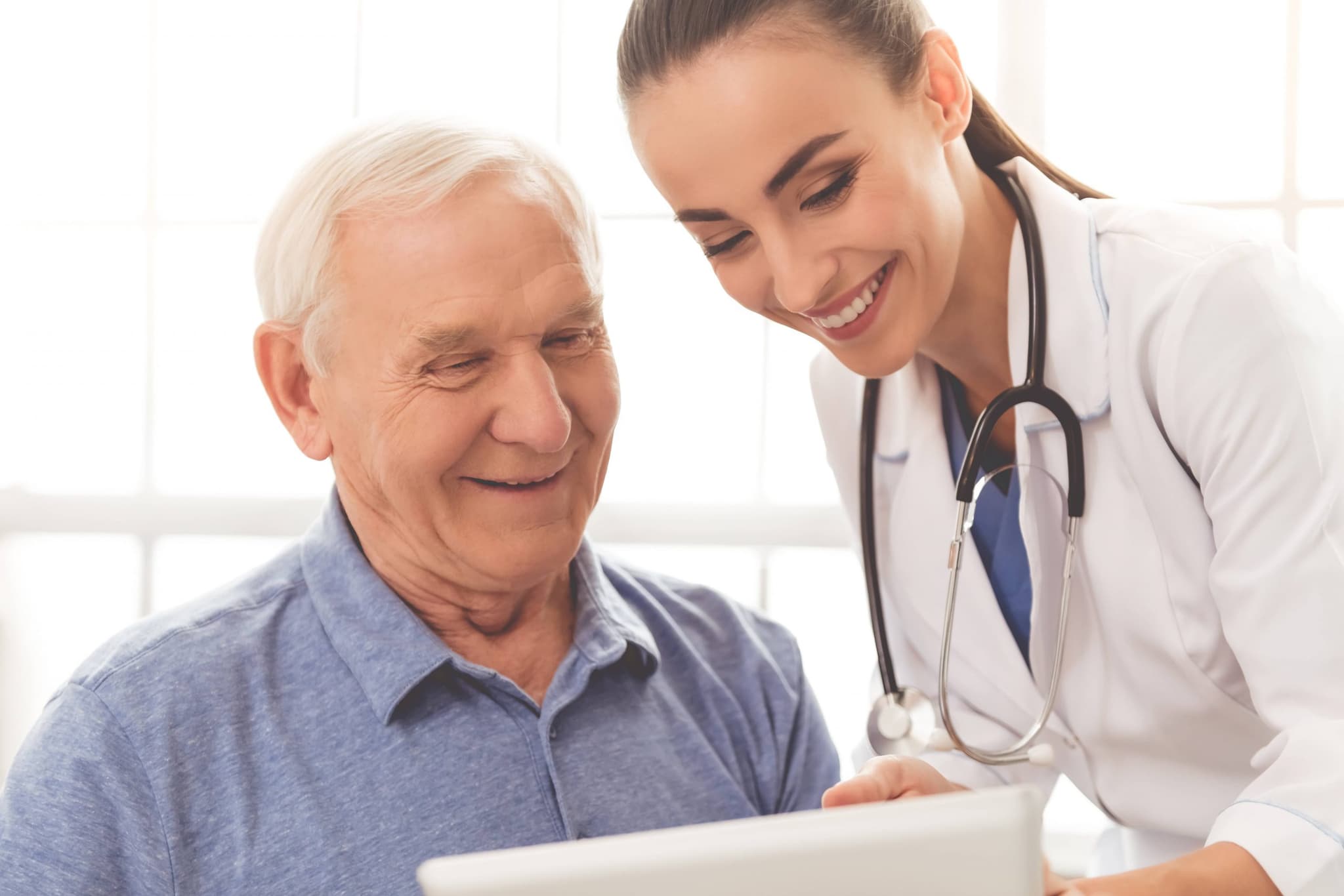 Female Doctor With Male Elderly Patient